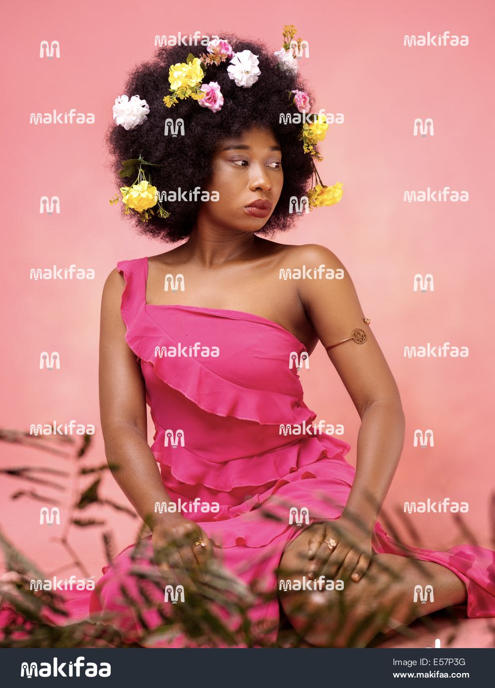 African Stylish portrait of a woman with afro hair posing sensually 
