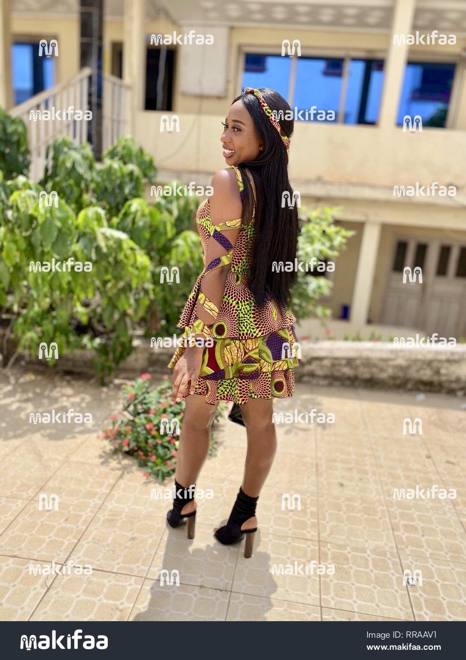 Beautiful Lady smiling in Ankara dress.