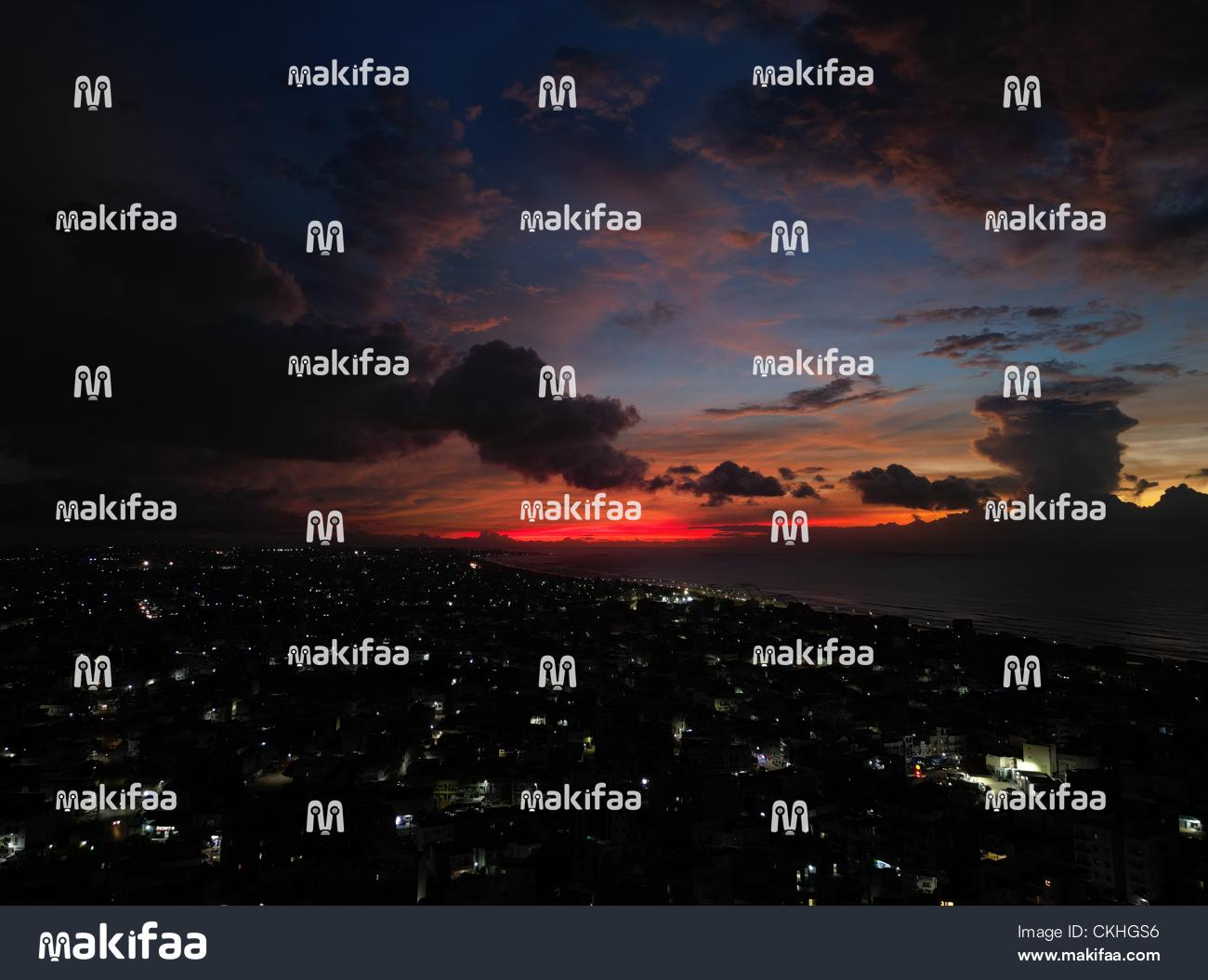 A brilliant sunset over a city  