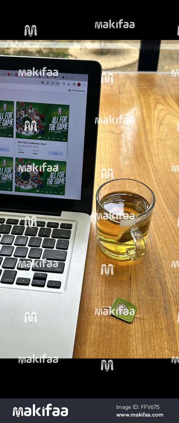 Green tea in Elegant glass Beside laptop