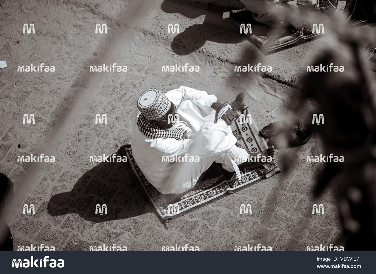 Muslim man praying in mosque 