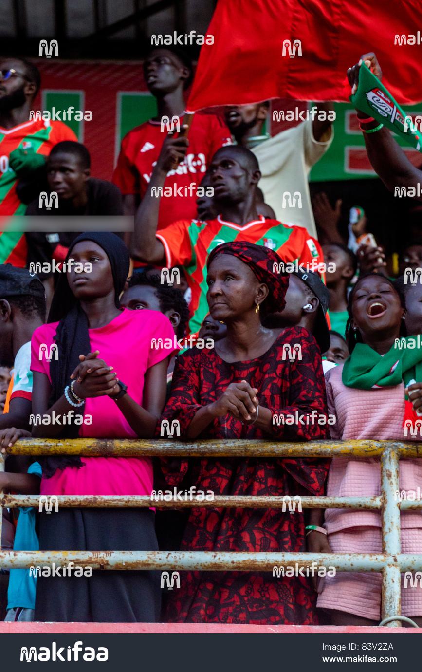 Group of people on a field supporting their teams 