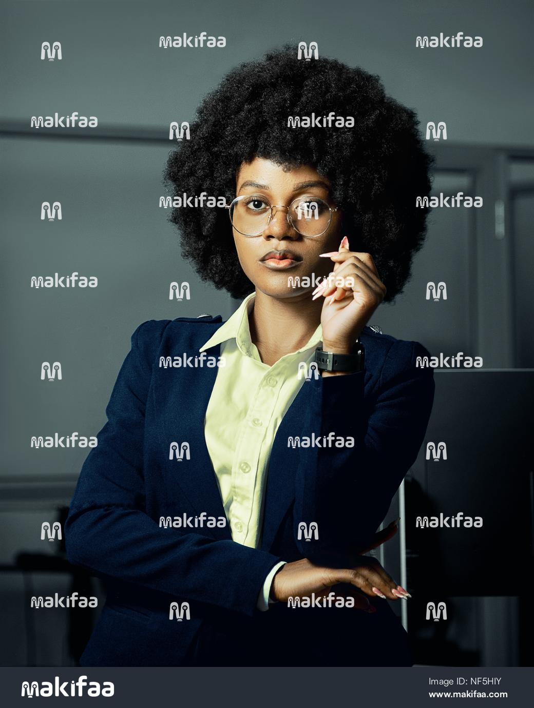 Professional portrait of a woman in a jacket in an office 