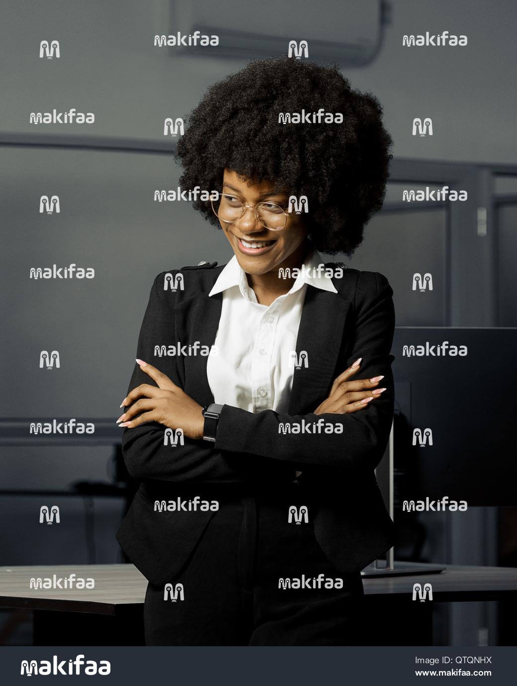 Portrait of a smiling young woman in an office 