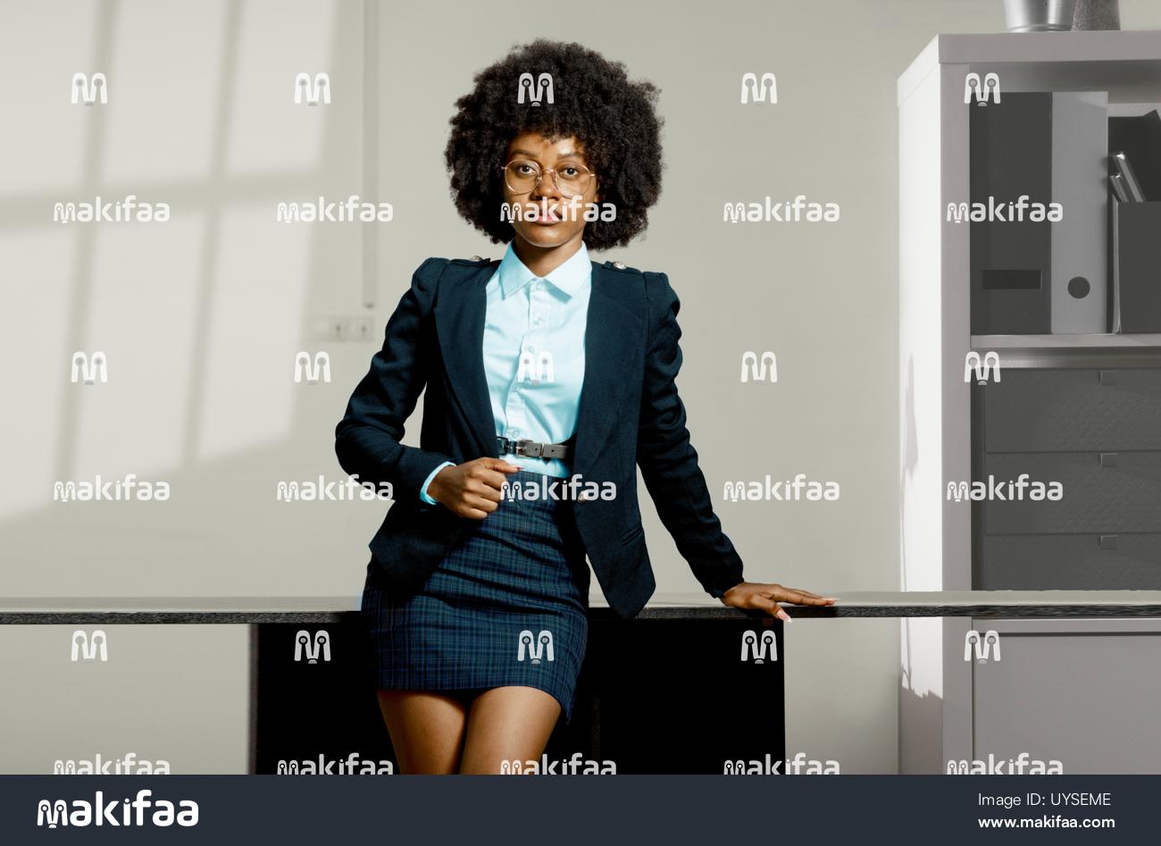 Professional portrait of a woman in a jacket in an office 