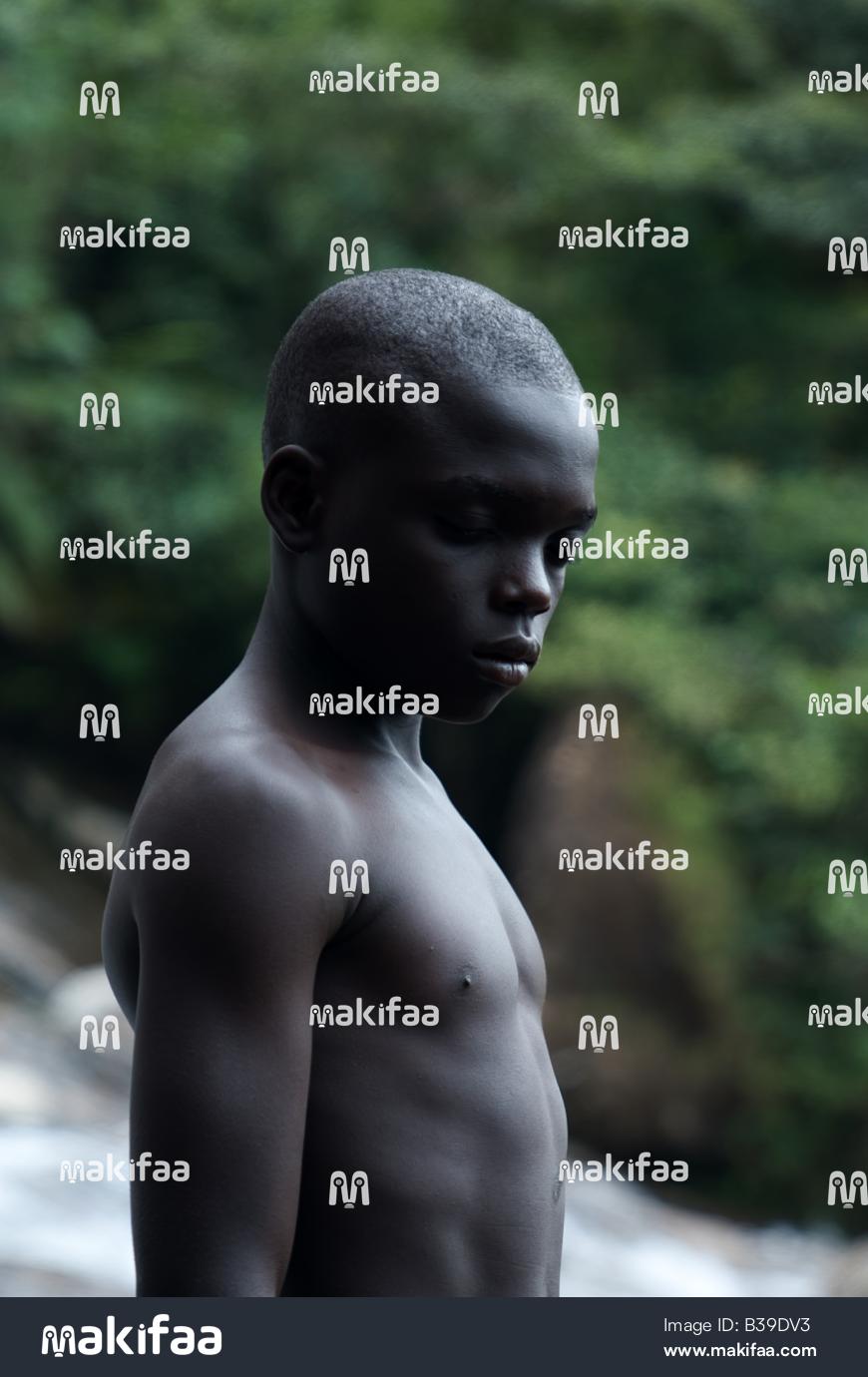 Portrait of a pensive boy in the middle of vegetation 