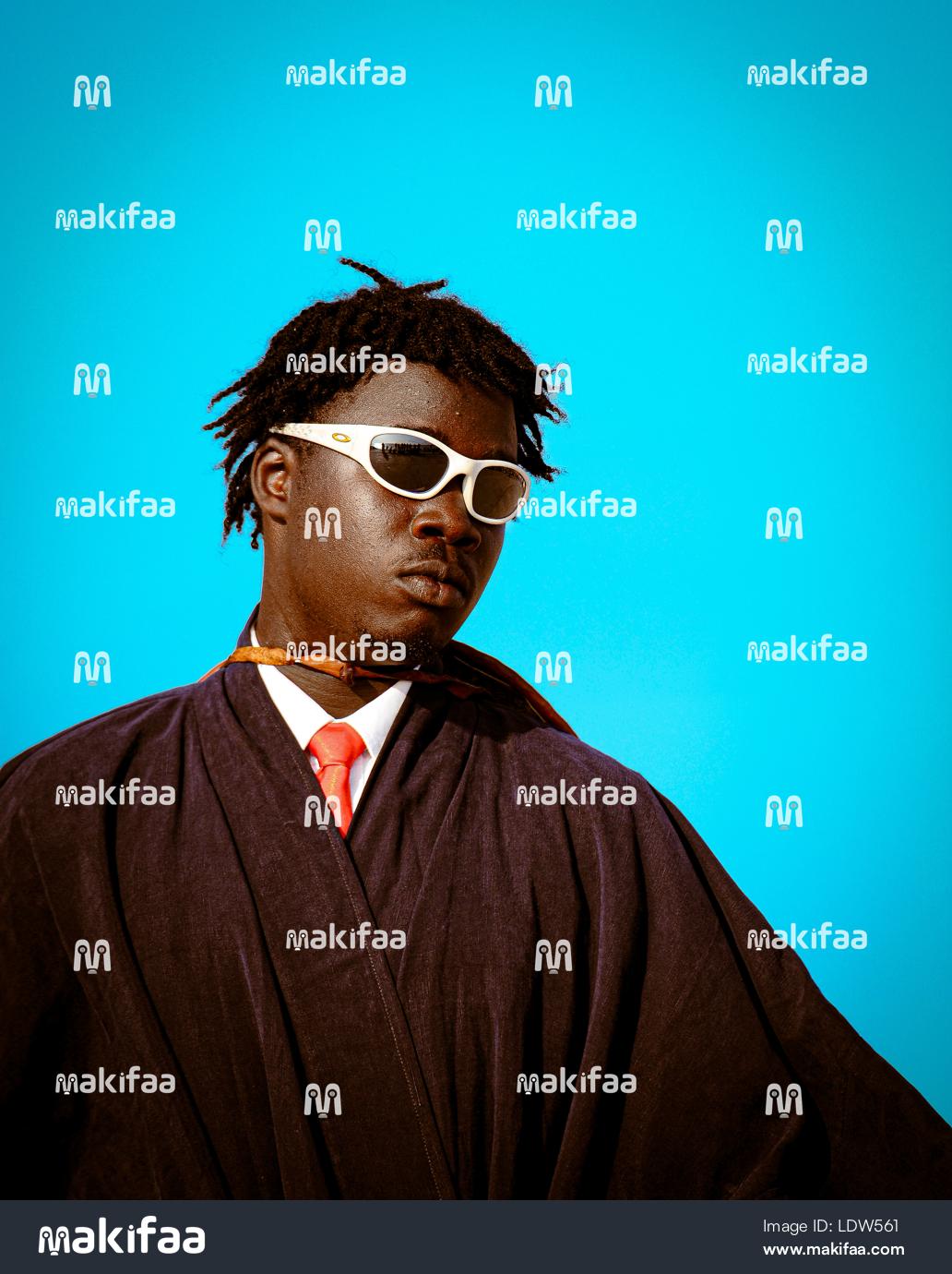 Home wearing glasses posing for a magazine