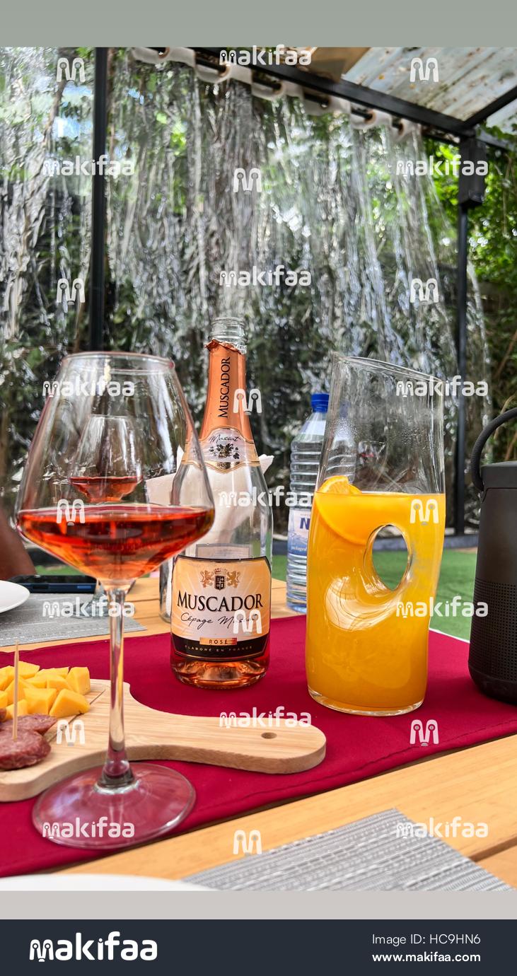 Rosé wine with a bottle of Muscador Rode and fresh orange juice