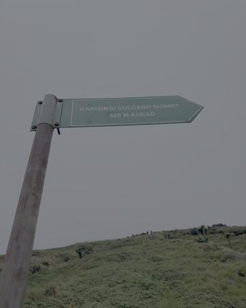 A directional pole to Karisimbi Volcano Summit Ahead in Rwanda