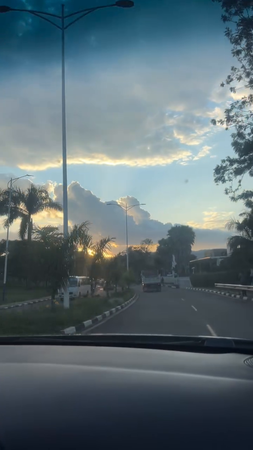 Panoramic view captured from a car driving through Kigali city. 