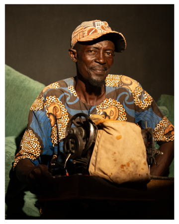 Craftsman concentrated in front of his sewing machine