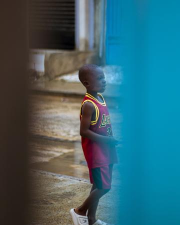 child in sportswear on a basketball court 