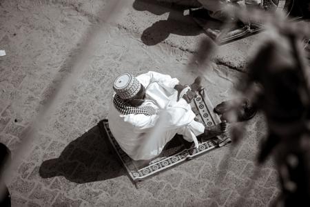 Muslim man praying in mosque 