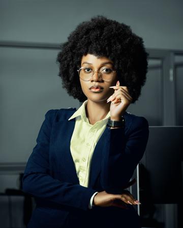 Professional portrait of a woman in a jacket in an office 