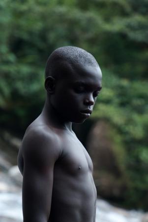 Portrait of a pensive boy in the middle of vegetation