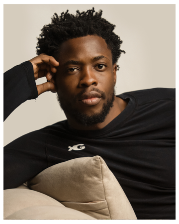 Portrait of a man lying on a cushion