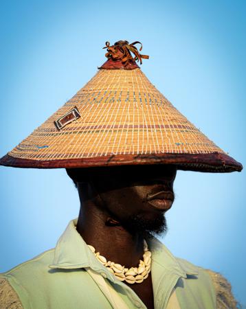 Stylish portrait of a young man wearing a hat 